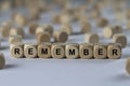 Remember - cube with letters, sign with wooden cubes