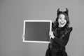 Remember the ghoul times. Little girl cute horns Halloween advertisement. Child imp hold blackboard. Halloween party