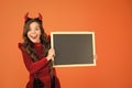 Remember the ghoul times. Little girl cute horns Halloween advertisement. Child imp hold blackboard. Halloween party