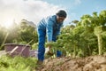 Remember, the land works for you. Full length shot of a male farm worker tending to the crops.