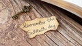 Remember Sabbath Day handwritten quote on ancient, old-fashioned paper, vintage rustic key, and Holy Bible Book on wooden table Royalty Free Stock Photo