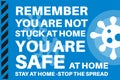 Remember You are Not Stuck at Home - You are safe at home - Illustration with virus logo on a blue background Royalty Free Stock Photo