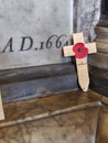 Rememberance poppy on cross crucifix in church