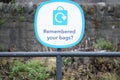 Remembered your plastic bags sign at supermarket retail shop sign Royalty Free Stock Photo