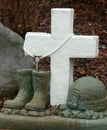 Soldier`s Memorial with a White Cross, Rosary Beads, Boots and Helmet Royalty Free Stock Photo