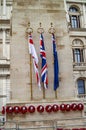 Remembering with wreath in london and flags on the pole