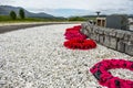 Remembrance day poppies laying close to the commando memorial in Spean bridge, Scotland - United Kingdom Royalty Free Stock Photo