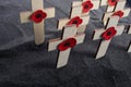 Remembrance Day poppy symbol on wooden cross. 11th November is a memorial day of the First World War. Royalty Free Stock Photo