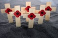 Remembrance Day poppy symbol on wooden cross. 11th November is a memorial day of the First World War. Royalty Free Stock Photo