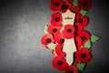 Remembrance Day poppy symbol on wooden cross. 11th November is a memorial day of the First World War. Royalty Free Stock Photo