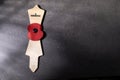 Remembrance Day poppy symbol on wooden cross. 11th November is a memorial day of the First World War. Royalty Free Stock Photo