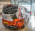 A rear view of a custom painted Ford Transit van at the 2019 Truck Fest