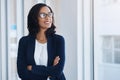 Always remind yourself about your goals. a young businesswoman looking thoughtful in an office.