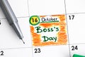 Reminder Boss Day in calendar with green pen.