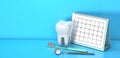 Reminder calendar for visiting the dentist. Dental appointment, check. Calendar with a tooth and a dental mirror and a Royalty Free Stock Photo