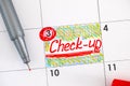 Reminder Check-up in calendar with red pen