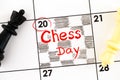 Reminder Chess Day in calendar with black and white chess pieces on it Royalty Free Stock Photo