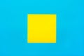 Reminder and combination concept- Close up one yellow empty square sticker on blue background with copy spase, mock up horizontal Royalty Free Stock Photo