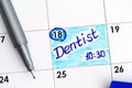 Reminder Dentist in calendar with blue pen