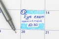 Reminder Eye exam appointment in calendar with pen Royalty Free Stock Photo