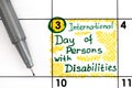 Reminder International Day of Persons with Disabilities in calendar with pen Royalty Free Stock Photo