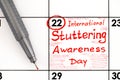 Reminder International Stuttering Awareness Day in calendar with pen