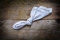 Reminder, knot in handkerchief of white cloth on a rustic wooden Royalty Free Stock Photo