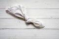 Reminder, knot in an old handkerchief on white painted wood, c