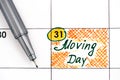 Reminder Moving Day in calendar with pen
