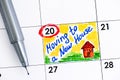 Reminder Moving to a New House in calendar with pen.