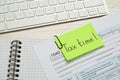 Reminder note with words Tax Time, documents and computer keyboard on white wooden table, closeup Royalty Free Stock Photo