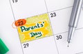 Reminder Parents Day in calendar with green pen.