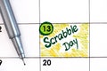 Reminder Scrabble Day in calendar with pen
