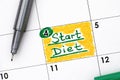 Reminder Start Diet in calendar with green pen.