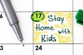 Reminder Stay Home with Kids in calendar with pen Royalty Free Stock Photo