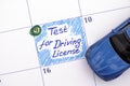 Reminder Test for Driving License in calendar with blue car Royalty Free Stock Photo
