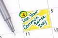 Reminder Use Your Common Sense Day in calendar with green pen