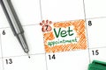 Reminder Vet Appointment in calendar with green pen.