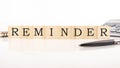 REMINDER word made with building blocks on white background Royalty Free Stock Photo