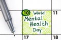 Reminder World Mental Health Day in calendar with pen