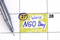 Reminder World NGO Day in calendar with pen