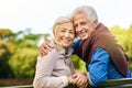 Reminding you what love is all about. Portrait of a happy senior couple sitting on a park bench. Royalty Free Stock Photo