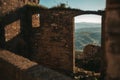 Remnants of an Abandoned Italian Home in Craco, with the Sky and a Beautiful Italian Landscape Visible through the Collapsed Roof Royalty Free Stock Photo