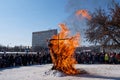 Remnants of a burned scarecrow on the winter Slavic holiday