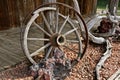 Remnants of an old buggy wheel used as as store front decoration. Royalty Free Stock Photo