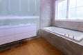 Remodeling bathroom with drywall repair, plastering painting