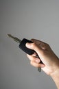 Remote car key in girl hand. Royalty Free Stock Photo