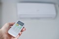 Remote control for air conditioner in hand Royalty Free Stock Photo