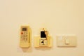 Remote control of air conditioner,key card,Switches Installed on the wall Royalty Free Stock Photo