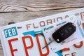 Remote control car keys on Florida license plate with driver license. Car driving in Florida Royalty Free Stock Photo